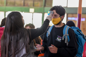 SANTIAGO DE CHILE, CHILE- In the photos taken on August 19, 2020, health professionals during a free mobile PCR testing operation for COVID-19 at the Bus Terminal in Santiago de Chile. Chile registered 1,233 new coronavirus infections in the last 24 hours, the lowest number in more than three months, while the country advances deconfinement measures and imposes new quarantines by sectors.