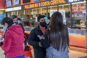 SANTIAGO DE CHILE, CHILE- In the photos taken on August 19, 2020, health professionals during a free mobile PCR testing operation for COVID-19 at the Bus Terminal in Santiago de Chile. Chile registered 1,233 new coronavirus infections in the last 24 hours, the lowest number in more than three months, while the country advances deconfinement measures and imposes new quarantines by sectors.