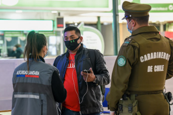 SANTIAGO DE CHILE, CHILE- In the photos taken on August 19, 2020, health professionals during a free mobile PCR testing operation for COVID-19 at the Bus Terminal in Santiago de Chile. Chile registered 1,233 new coronavirus infections in the last 24 hours, the lowest number in more than three months, while the country advances deconfinement measures and imposes new quarantines by sectors.