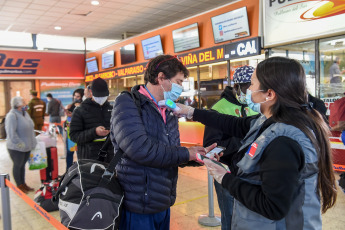 SANTIAGO DE CHILE, CHILE- In the photos taken on August 19, 2020, health professionals during a free mobile PCR testing operation for COVID-19 at the Bus Terminal in Santiago de Chile. Chile registered 1,233 new coronavirus infections in the last 24 hours, the lowest number in more than three months, while the country advances deconfinement measures and imposes new quarantines by sectors.
