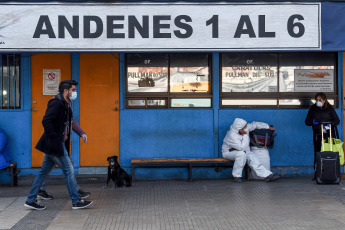 SANTIAGO DE CHILE, CHILE- In the photos taken on August 19, 2020, health professionals during a free mobile PCR testing operation for COVID-19 at the Bus Terminal in Santiago de Chile. Chile registered 1,233 new coronavirus infections in the last 24 hours, the lowest number in more than three months, while the country advances deconfinement measures and imposes new quarantines by sectors.