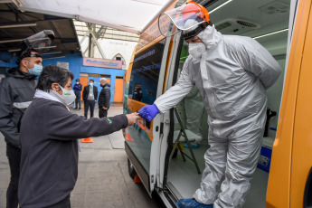 SANTIAGO DE CHILE, CHILE- In the photos taken on August 19, 2020, health professionals during a free mobile PCR testing operation for COVID-19 at the Bus Terminal in Santiago de Chile. Chile registered 1,233 new coronavirus infections in the last 24 hours, the lowest number in more than three months, while the country advances deconfinement measures and imposes new quarantines by sectors.
